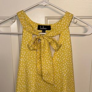 Polka dot sleeveless blouse with keyhole opening in back